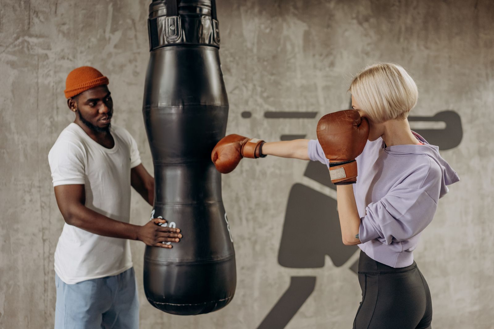 kickboxer punching a heavy bag with intensity